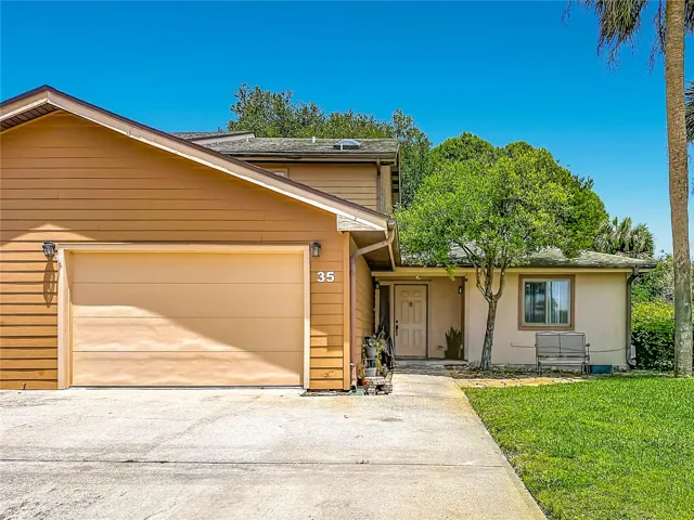 Front view, with 2 car garage.
