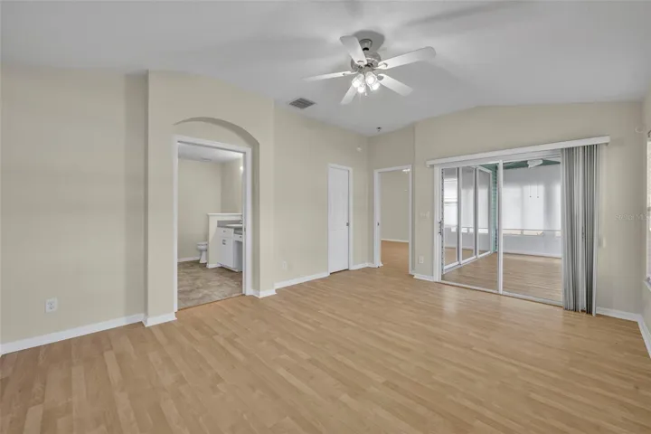 Primary bedroom, view of patio