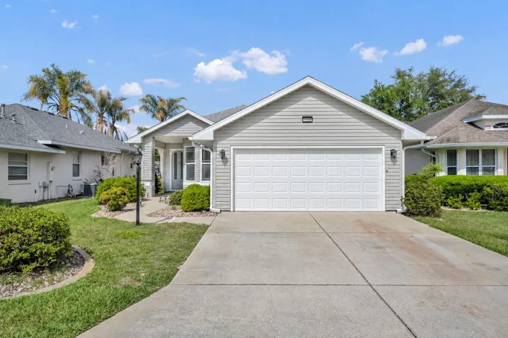 front exposure, virtually staged without garage screen