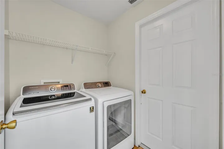 Laundry room between kitchen and garage