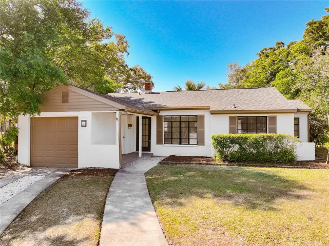 Charming updated home with great curb appeal, 1-car garage, and spacious front yard.