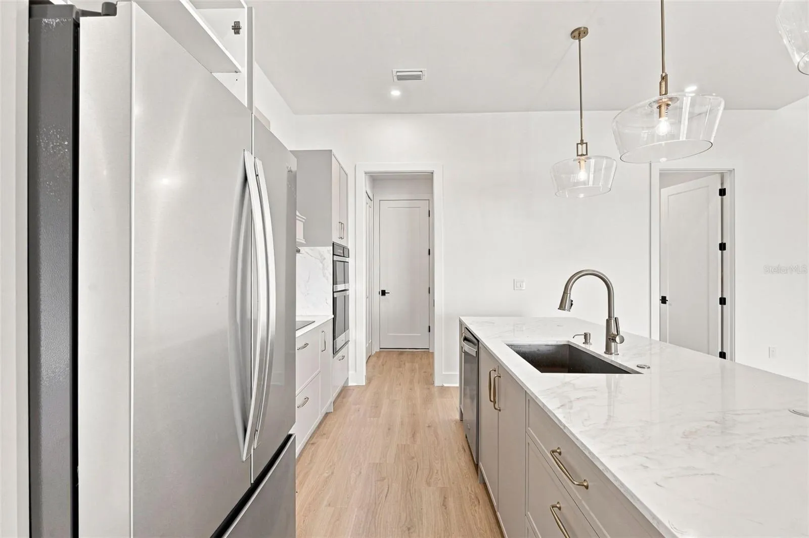 Luxury Kitchen with Waterfall Island & Waterfront Views