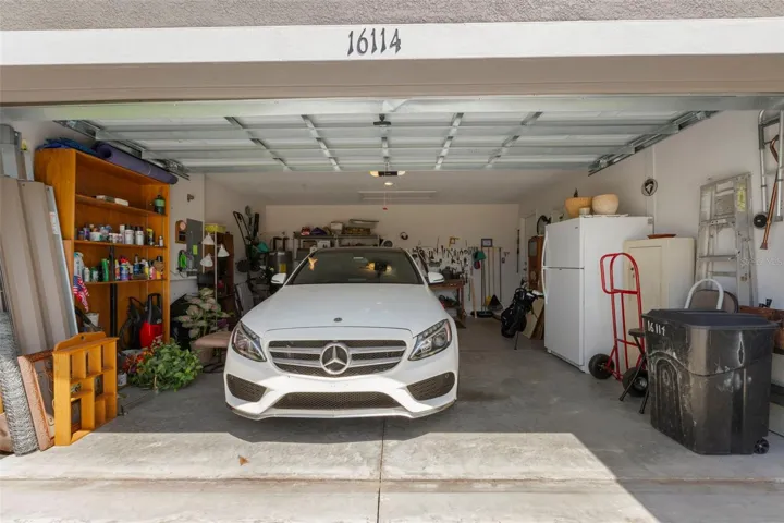 The oversized two-car garage provides ample room for parking, storage, hobbies, or workshop space.