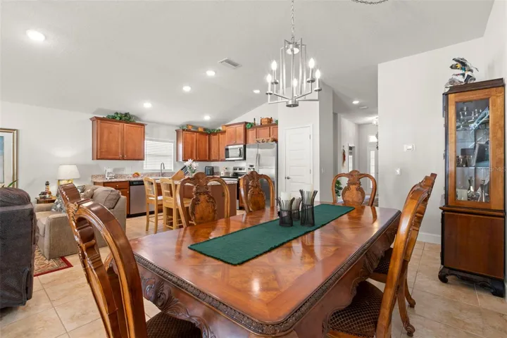 Positioned just off the kitchen, the dining area offers effortless serving and entertaining flow while maintaining open connectivity to the home’s main gathering spaces.