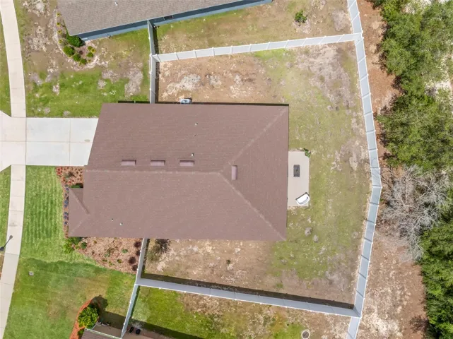 Aerial view emphasizing the expansive back yard.