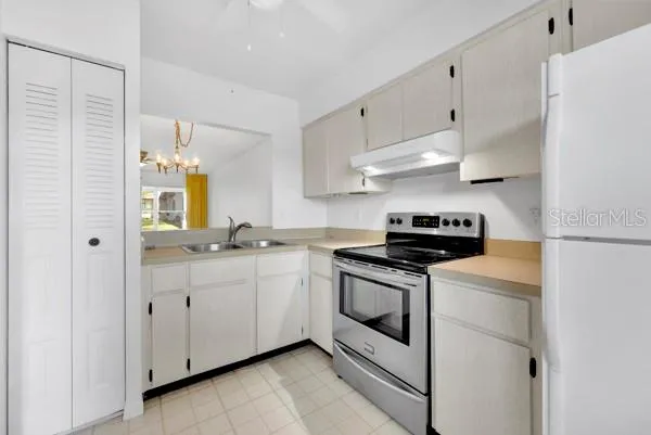 KITCHEN WITH PANTRY AND REFRIG &amp; STOVE