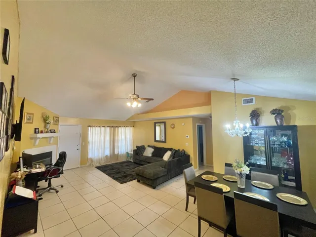 Great room with fireplace and high vaulted ceilingss