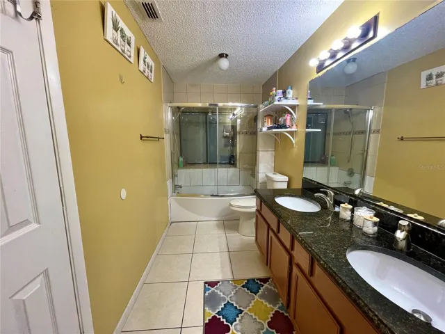 Double sink vanity in Primary Bedroom Suite withGranite Countertops!