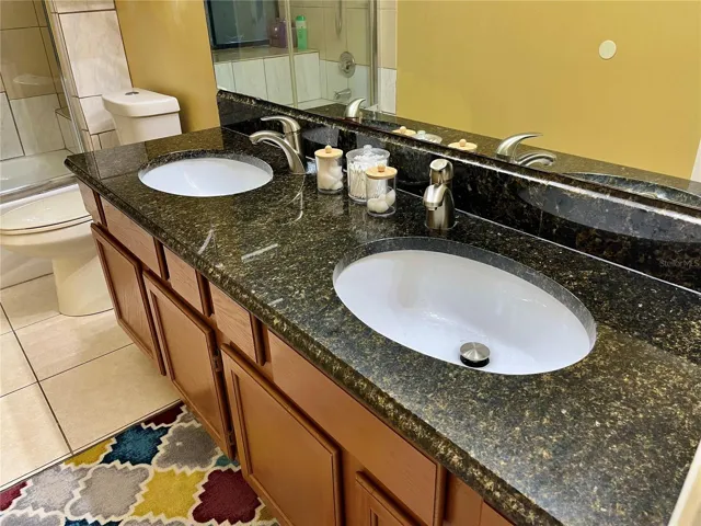 Double sink vanity in Primary Bedroom Suite withGranite Countertops!