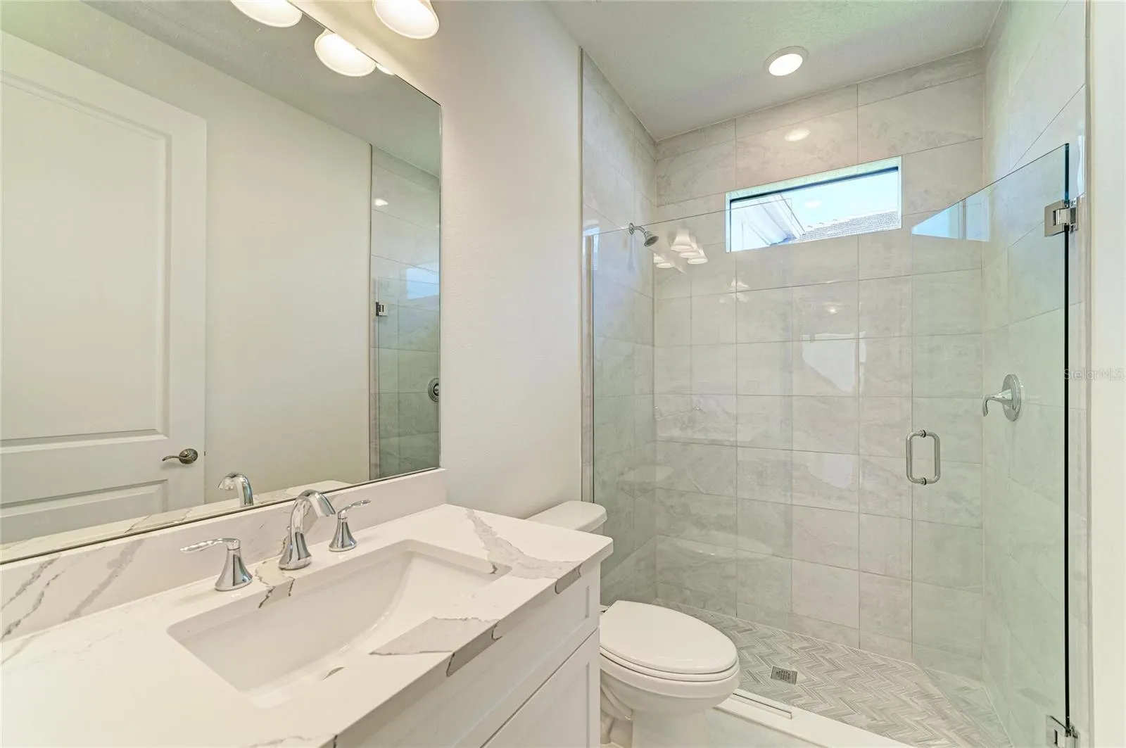 Secondary Bath upgraded tile and shower doors