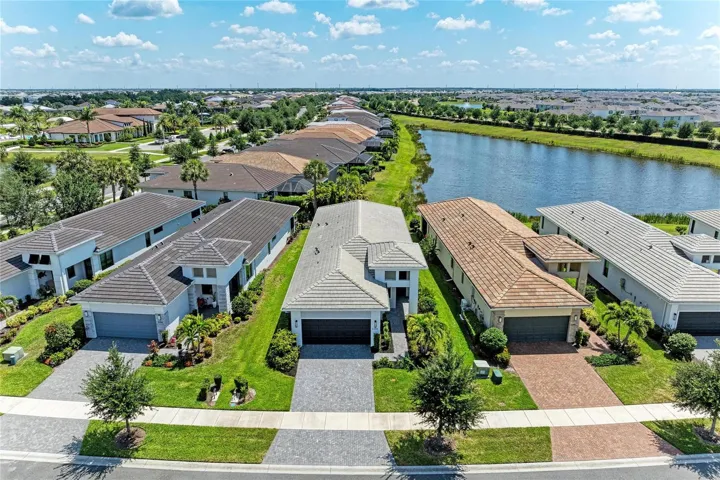Aerial view of the home and pond
