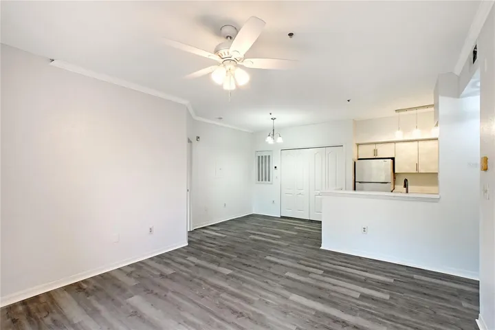Great Room with new laminate floors looking into Kitchen and Dining Area