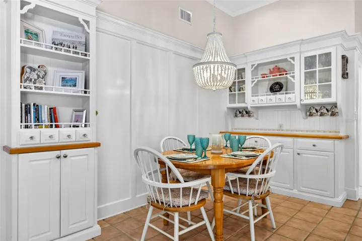 Coffee bar area with cabinets to store all the essentials