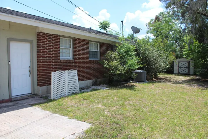 This is the back yard entrance to the home which leads to the bonus room off the kitchen.