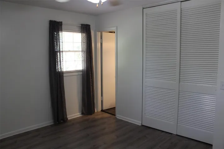 This is the primary bedroom with two windows, a built in closet and a half bathroom! Luxury Vinyl Plank flooring!