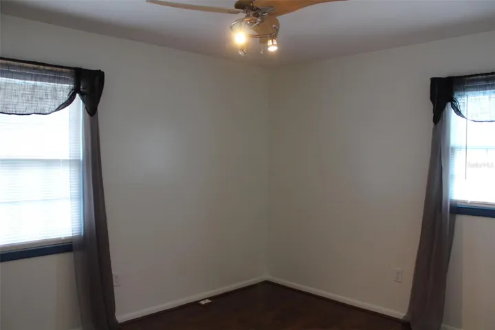 This is the second bedroom complete with two windows, a new light fixture and new flooring!