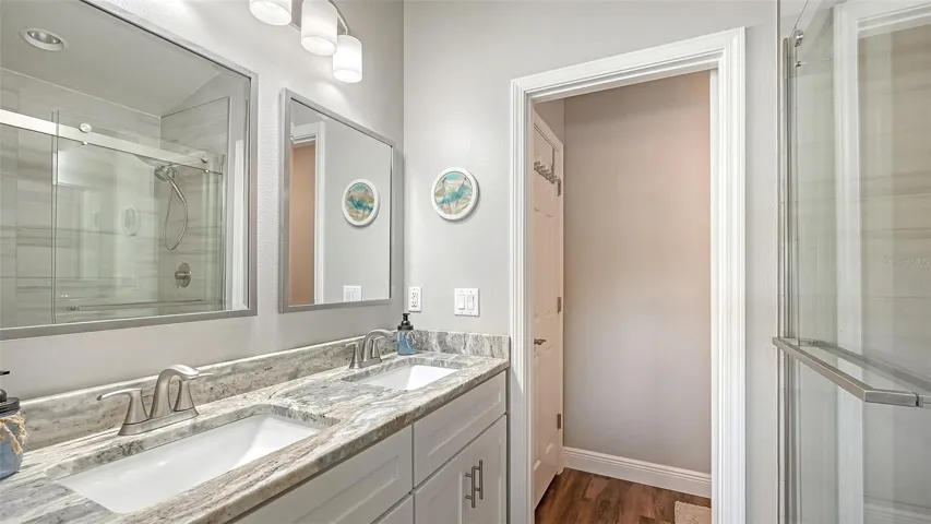 Dual vanities, water closet, shower