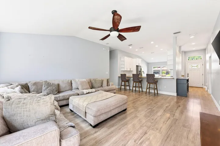 Light, bright open living area under vaulted ceilings.