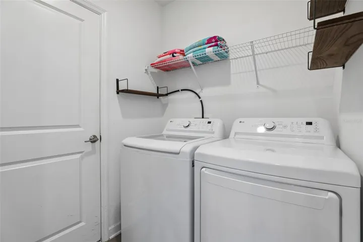 A convenient LAUNDRY ROOM is located just off the Kitchen.
