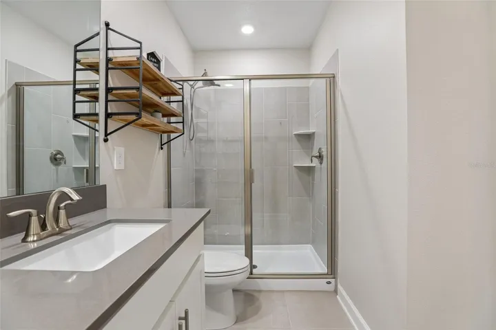 The private Primary EN SUITE BATH features dual sinks and a spacious step-in shower.