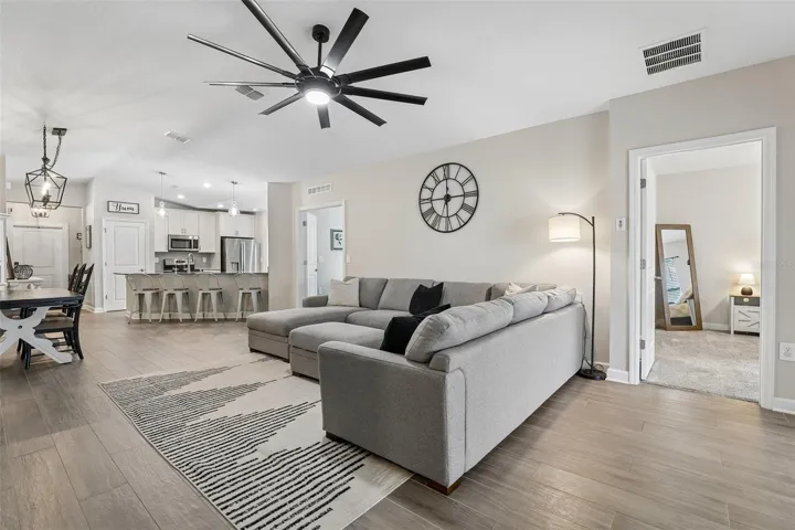 A bright and open layout enhanced by WOOD-LOOK TILE FLOORING throughout the main living areas, creates a seamless flow between spaces.