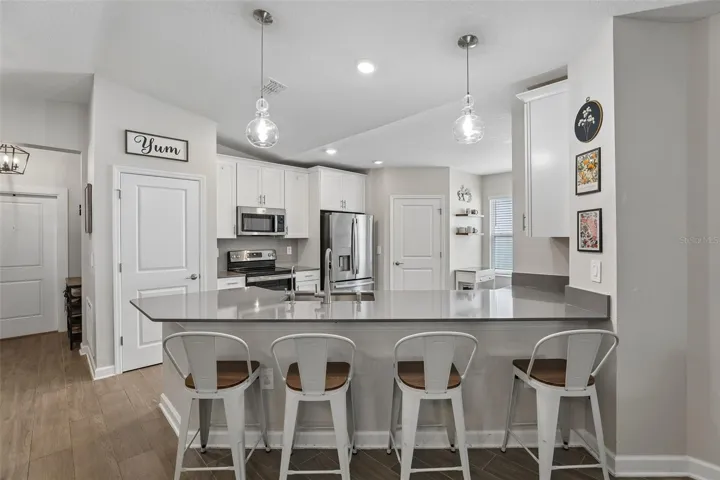 The breakfast bar provides extra prep space and room for counter-height seating.