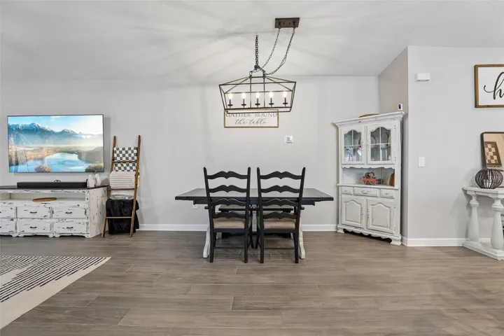 The inviting Dining area, adjacent to the Kitchen and Living Room, is ideal for relaxed everyday dining.