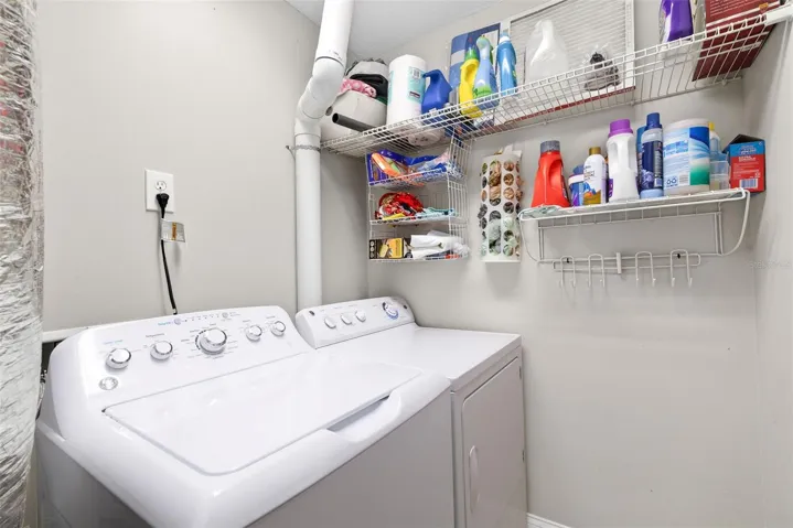 Inside utility room with washer and dryer