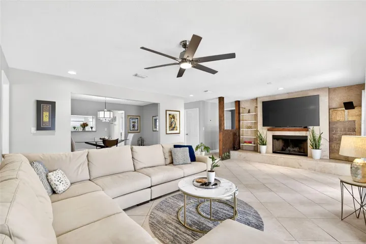 Living room with travertine tile feature wall