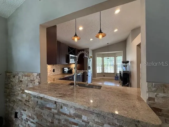 Natural stone accent wall at pass thru