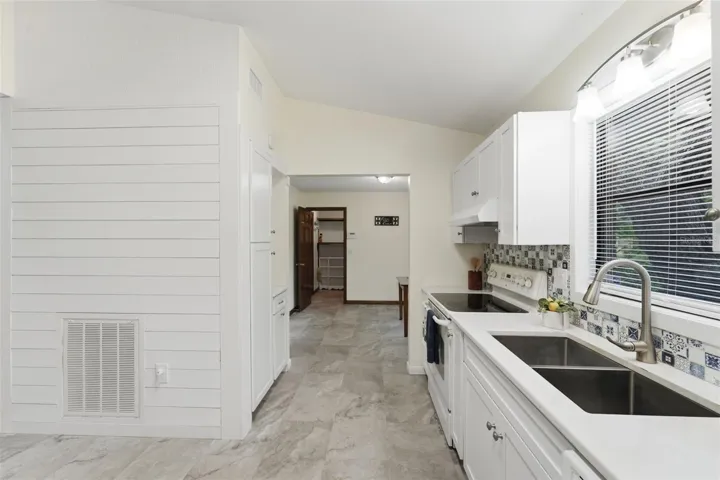 KITCHEN LEADING TO NOOK & HALF BATH