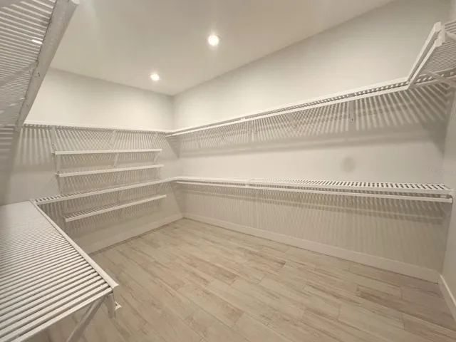 Primary walk-in closet.