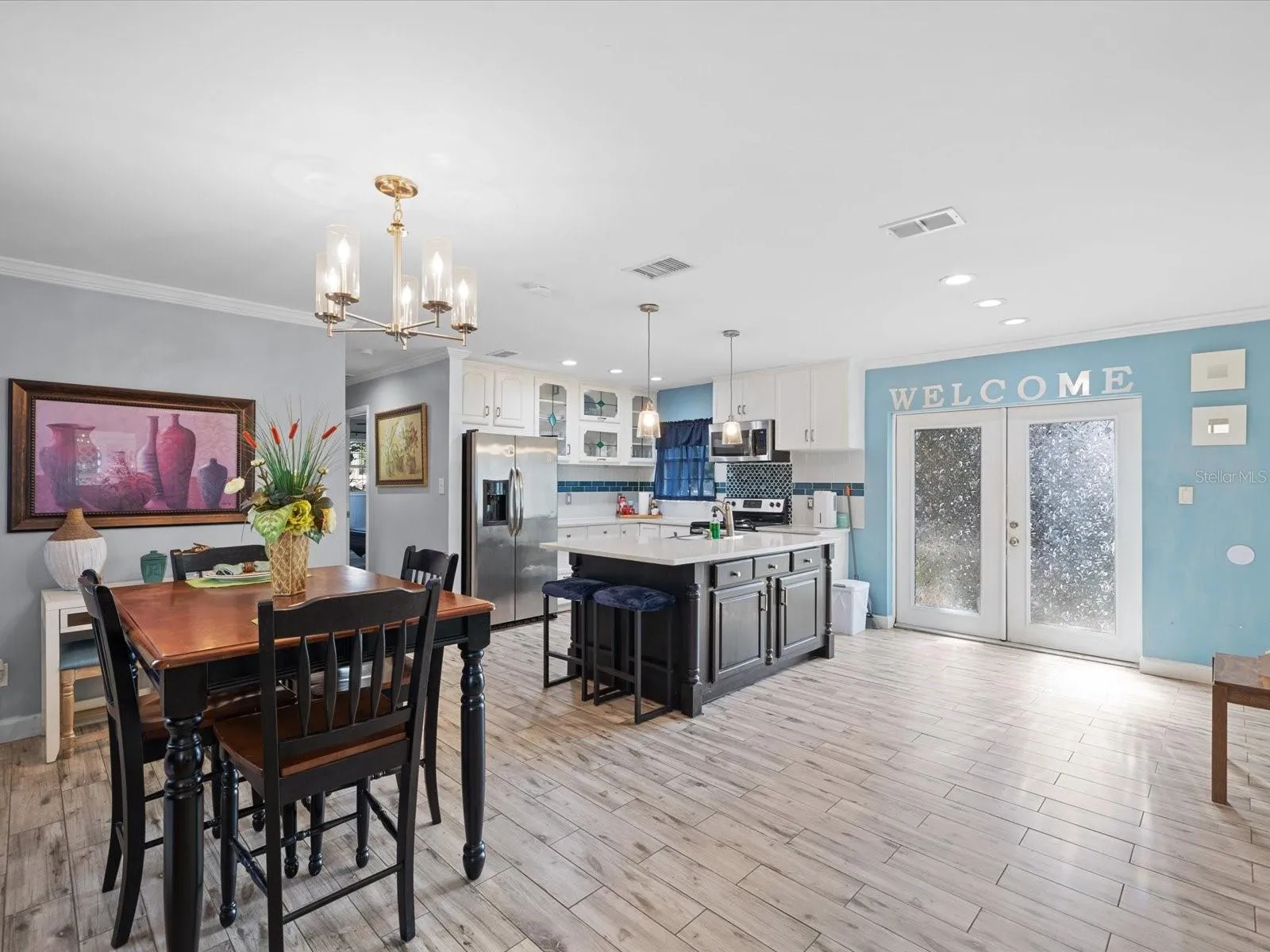 Updated kitchen that leads to a fenced patio and spacious backyard