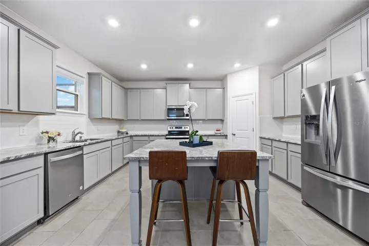 Granite Counter Tops, Huge Island, Tons of Cabinets