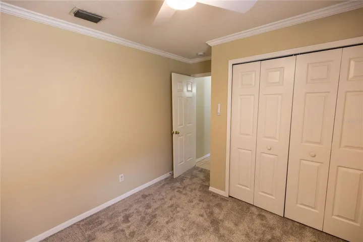 2nd bedroom with fan and light on remote control