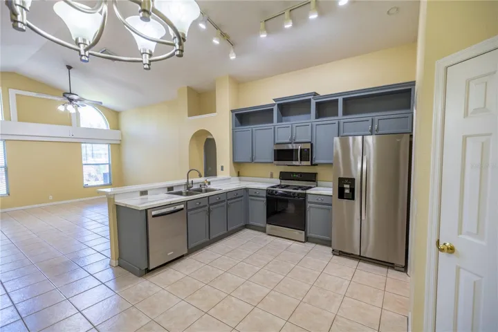 Kitchen with gas stove, refrigerator with ice maker, eat-in breakfast area, spacious closet pantry and room for a prep island