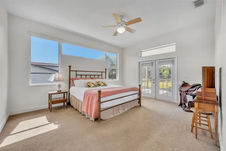 Primary suite with access to screened rear porch