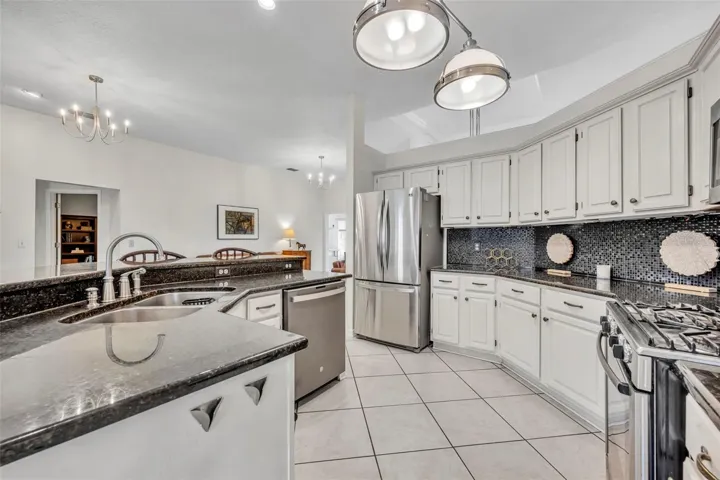 Kitchen with refinished cabinets & updated backsplash