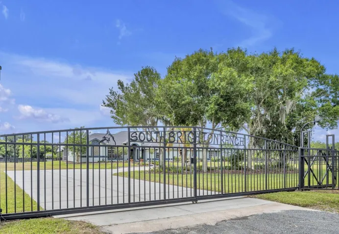 Fully fenced property with security gated entrance & expansive drive