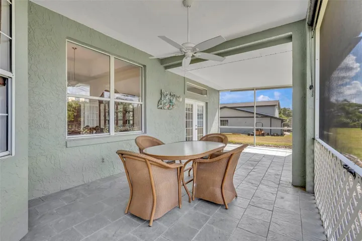 Screened rear patio, accessible from the primary suite