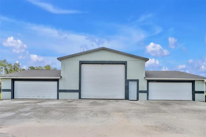 Massive 3-bay garage- can house 6 cars side-by-side, even more parked in tandem