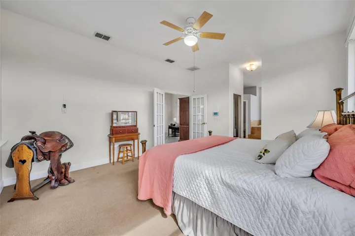 Primary suite with dual walk-in closets & en-suite bath