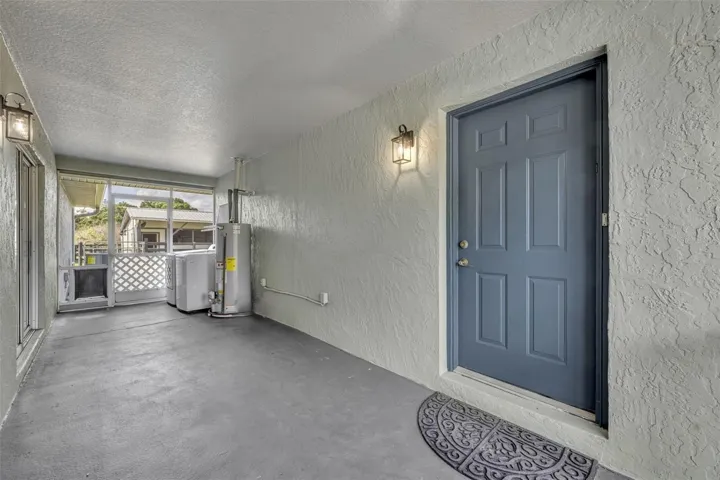 Covered, screened breezeway connecting main & guest houses