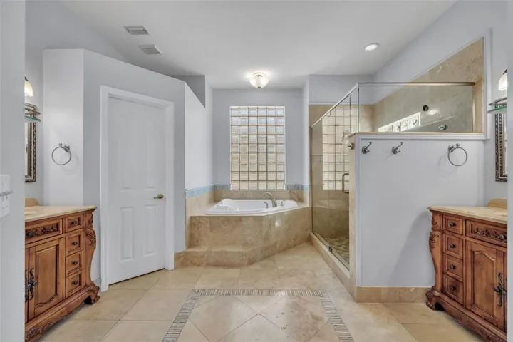 Primary bath with split vanities & private water closet