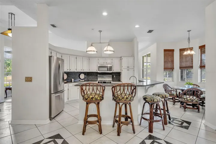 Open kitchen with breakfast bar for additional seating