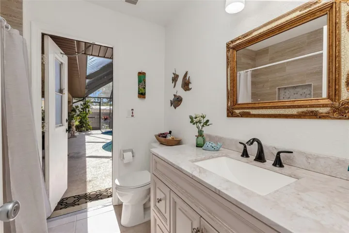 GUEST BATH DOOR TO POOL