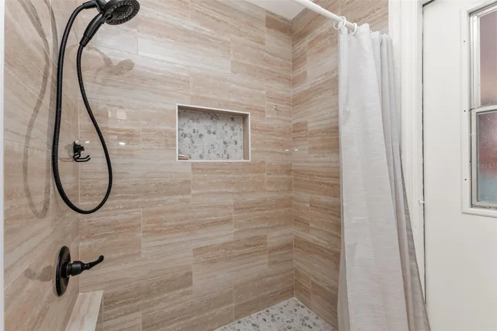 BEAUTIFUL TILED SHOWER IN GUEST BATH