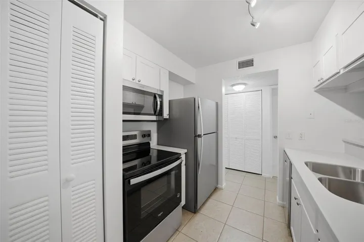 New updated kitchen with solid surface counters