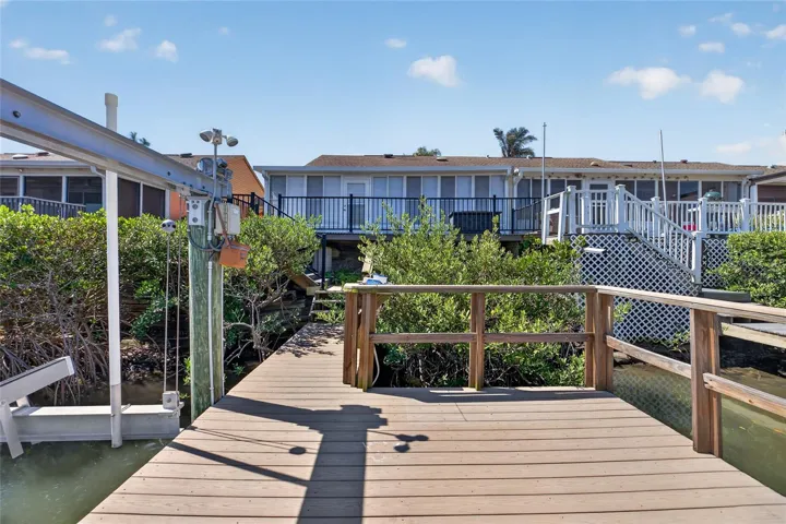 View from the dock and boat lift towards the villa.