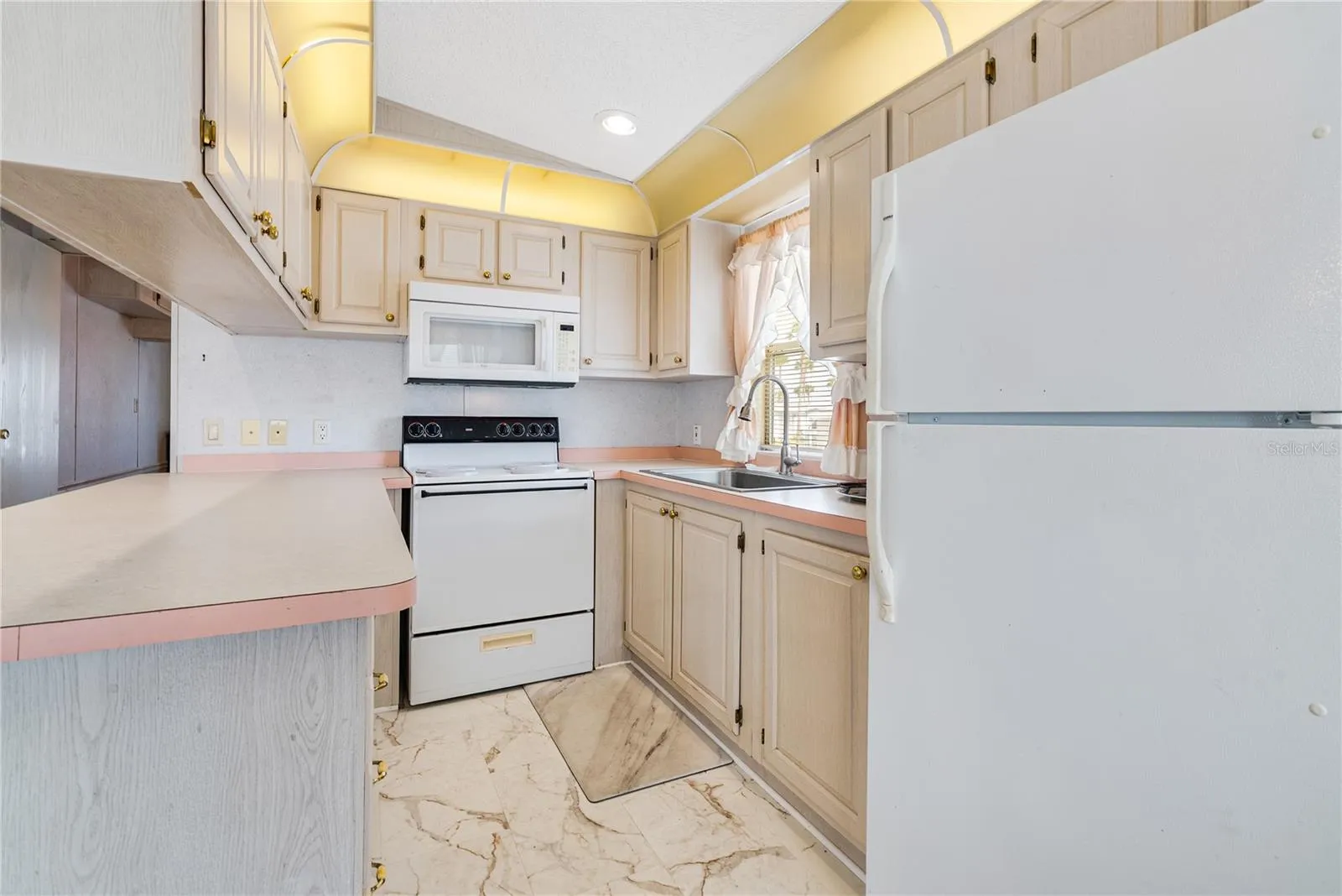 Kitchen has plenty of storage and countertop